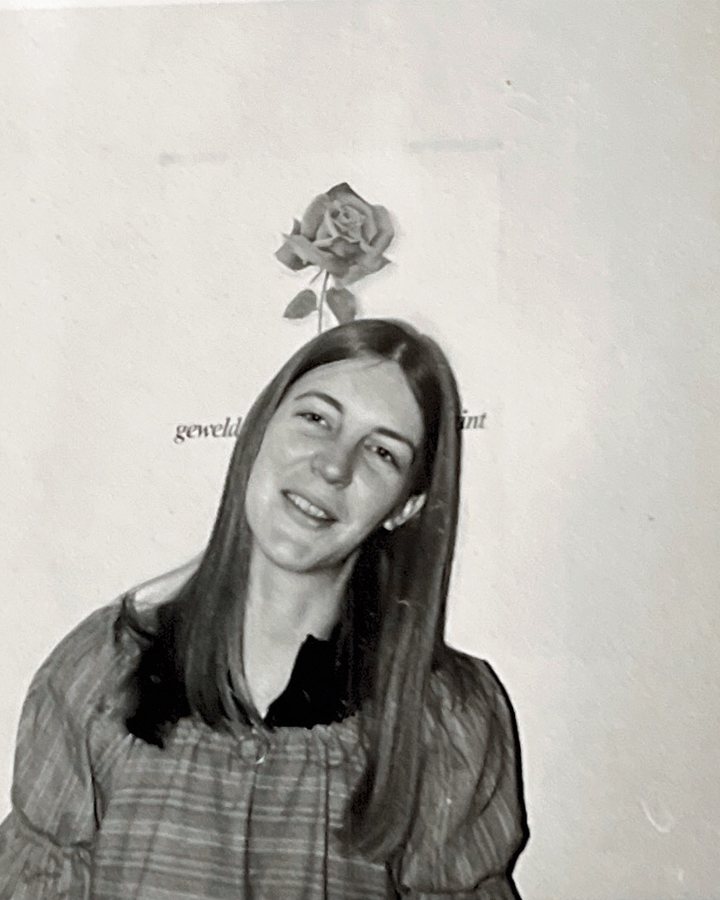 Anne as a young woman, smiling, black and white